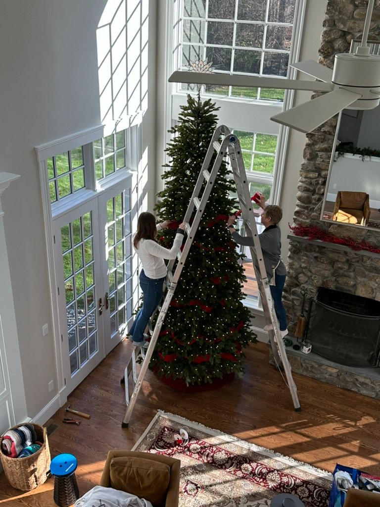 An Organized Life's professional team decorates a Christmas tree.