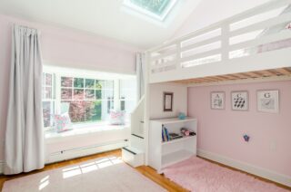 Achild's bedroom has a bunk bed and a study area underneath - an organized life, ma