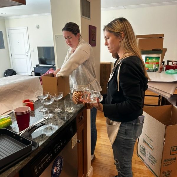 Spring Decuttering: An Organized Life staff is boxing and organizing kitchen wares.